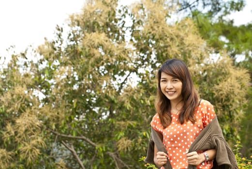 Portrait Of Asian Young Woman In garden in winter season