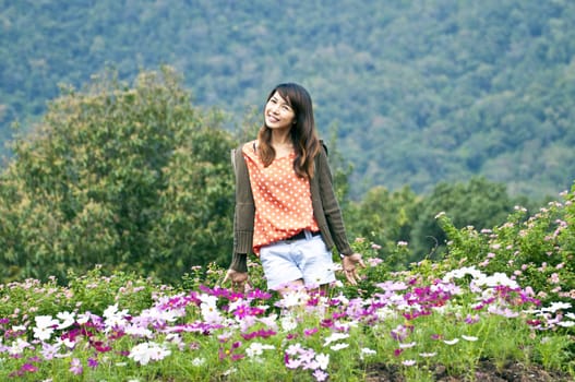 Portrait Of Asian Young Woman In garden on the mountain in winter season