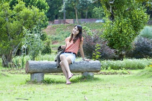 Portrait Of Asian Young Woman In garden in winter season