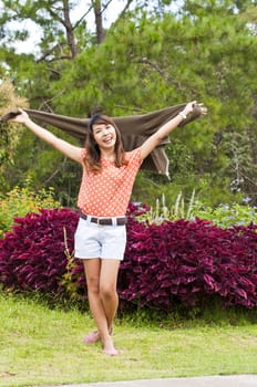 Portrait Of Asian Young Woman In garden in winter season