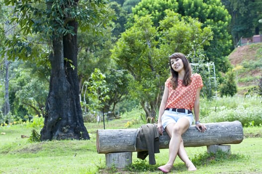 Portrait Of Asian Young Woman In garden in winter season