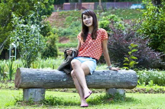 Portrait Of Asian Young Woman In garden in winter season