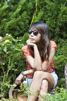 Portrait Of Asian Young Woman In garden in winter season