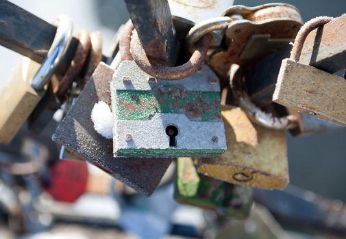 Love padlocks - symbol of eternal happiness.  Love padlocks hanging on the railing of the bridge