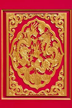 Golden dragon decorated on chinese temple door