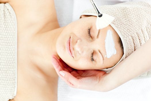 Beautiful relaxed woman receiving a beauty treatment in a spa center