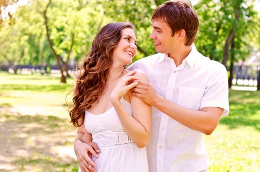 couple hugging in the park, have a good time together