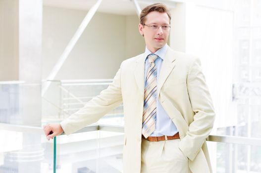 Smiling business man , on the balcony