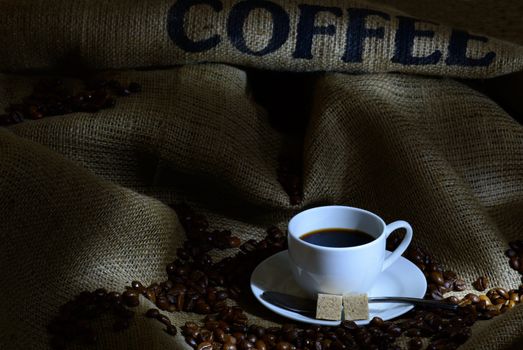 Coffee cup,  beans and burlap. still life