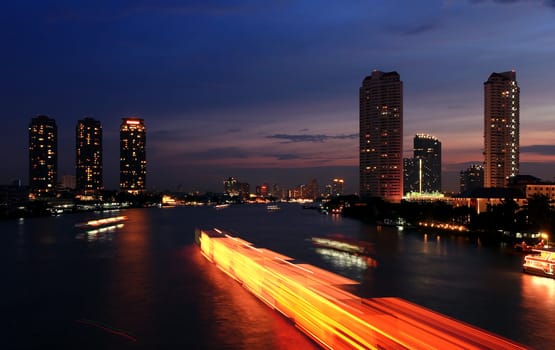 The light from the tallest building in the city and the river. Beautiful views of Bangkok Thailand.