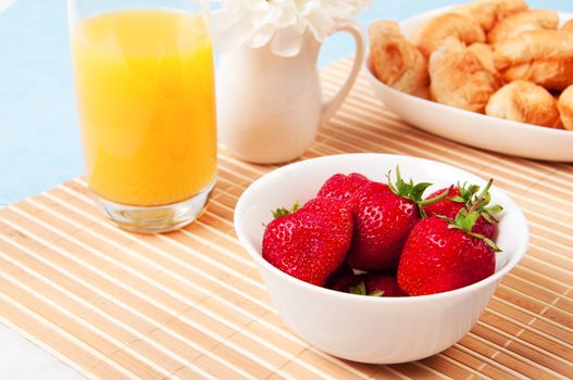 Breakfast with berries,orange juice and croissant, early breakfast