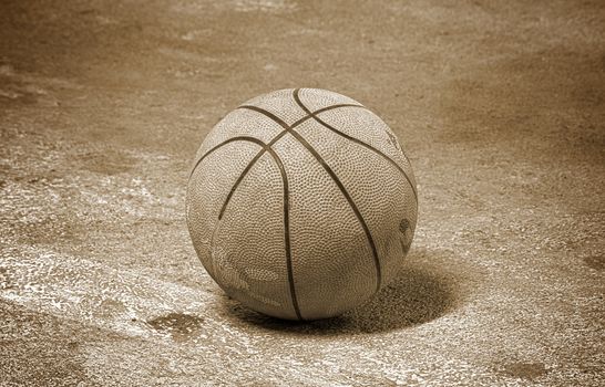 Old basketball. Screw on the dark background.