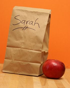 A brown lunch bags prepared specially for Sarah.