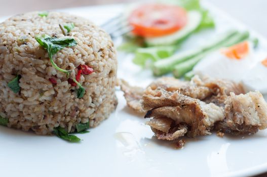 spicy fried rice with fried fish with salted egg