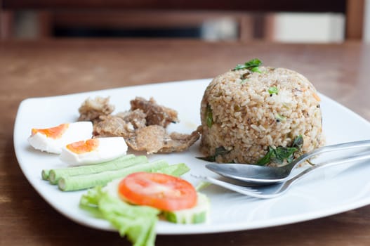 spicy fried rice with fried fish with salted egg