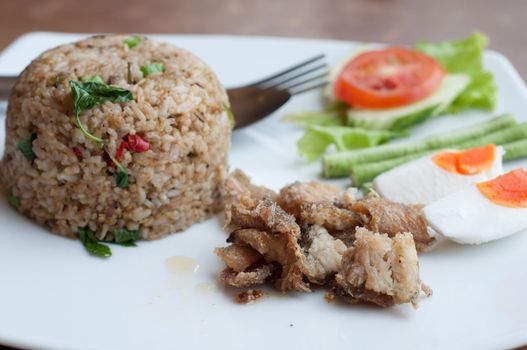 spicy fried rice with fried fish with salted egg