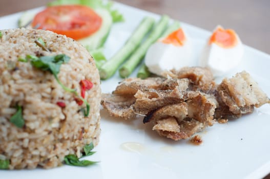 spicy fried rice with fried fish with salted egg