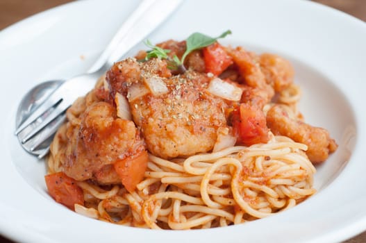 spaghetti with spicy fried fish on sauce