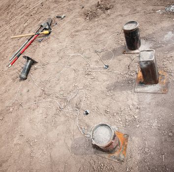 Set of explosive mortars and tools in desert