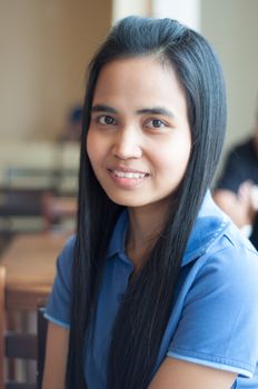 asian thai woman portrait in blue shirt