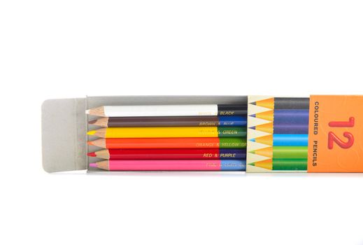 use old pencil color in box on white background isolated