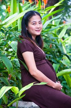 beautiful pregnant mother to be in nature