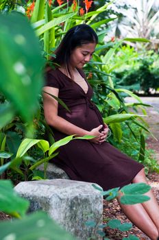 beautiful pregnant mother to be in nature