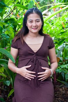 beautiful pregnant mother to be in nature