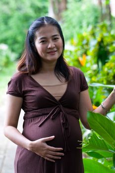 beautiful pregnant mother to be in nature