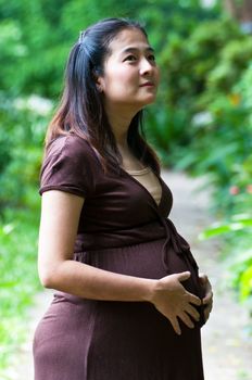 beautiful pregnant mother to be in nature