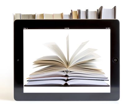 Ipad 3 with books on white background