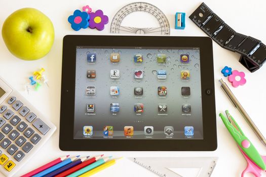 Ipad 3 with school accesories on white background