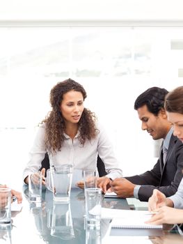 Business team working together around a table during a meeting 