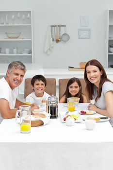 Family having breakfast in the kitchen at home