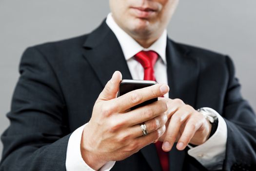An image of a business man with his mobile phone