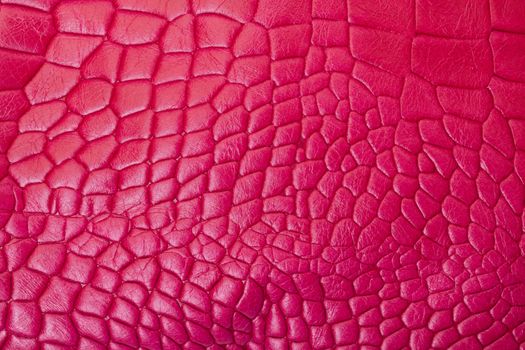 Abstract background of textured pink leather with a random pattern used for fashion accessories