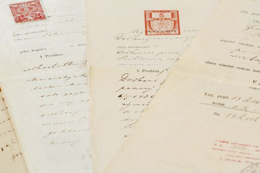 group of very old handwritten text agreements or contract