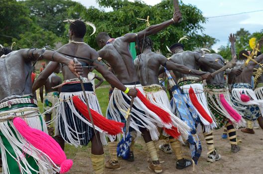 African men perform in a tribal dance
