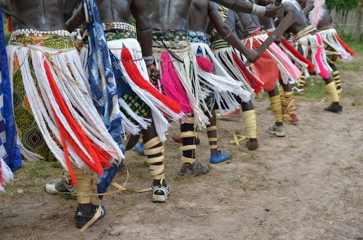 African men perform in a tribal dance