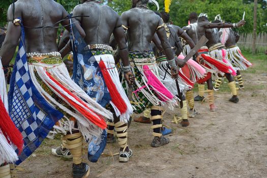 African men perform in a tribal dance