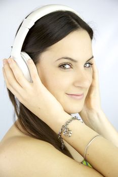 Cute young woman happy listening music with headphones