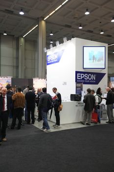 MILAN, ITALY - OCTOBER 17: People visit technologies products exhibition area at SMAU, international fair of business intelligence and information technology October 17, 2012 in Milan, Italy.