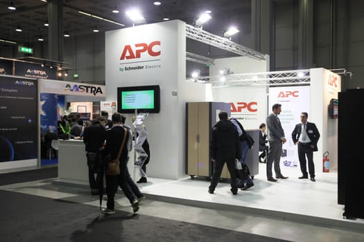 MILAN, ITALY - OCTOBER 17: People visit technologies products exhibition area at SMAU, international fair of business intelligence and information technology October 17, 2012 in Milan, Italy.