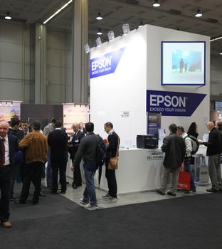 MILAN, ITALY - OCTOBER 17: People visit technologies products exhibition area at SMAU, international fair of business intelligence and information technology October 17, 2012 in Milan, Italy.