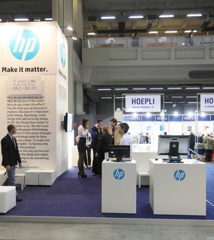 MILAN, ITALY - OCTOBER 17: People visit HP technologies products exhibition area at SMAU, international fair of business intelligence and information technology October 17, 2012 in Milan, Italy.