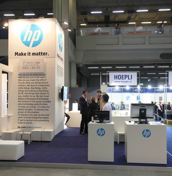 MILAN, ITALY - OCTOBER 17: People visit HP technologies products exhibition area at SMAU, international fair of business intelligence and information technology October 17, 2012 in Milan, Italy.