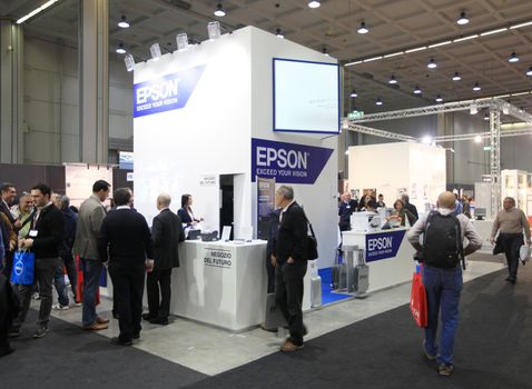 MILAN, ITALY - OCTOBER 17: People visit Epson technologies products exhibition area at SMAU, international fair of business intelligence and information technology October 17, 2012 in Milan, Italy.