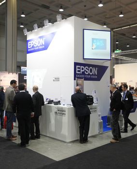 MILAN, ITALY - OCTOBER 17: People visit Epson technologies products exhibition area at SMAU, international fair of business intelligence and information technology October 17, 2012 in Milan, Italy.