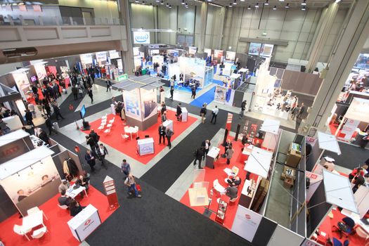 MILAN, ITALY - OCTOBER 17: People visit technologies products exhibition area at SMAU, international fair of business intelligence and information technology October 17, 2012 in Milan, Italy.