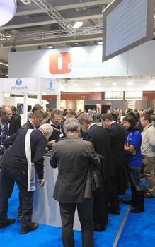 MILAN, ITALY - OCTOBER 17: People visit Olivetti technologies products exhibition area at SMAU, international fair of business intelligence and information technology October 17, 2012 in Milan, Italy.